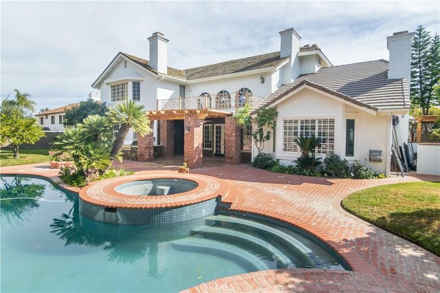 29515 Weeping Willow Dr, Agoura Hills, CA 91301 - back of house featuring stucco siding, a balcony, a chimney, and a patio