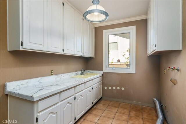 29515 Weeping Willow Dr, Agoura Hills, CA 91301 - laundry room featuring cabinet space, crown molding, baseboards, and light tile patterned floors