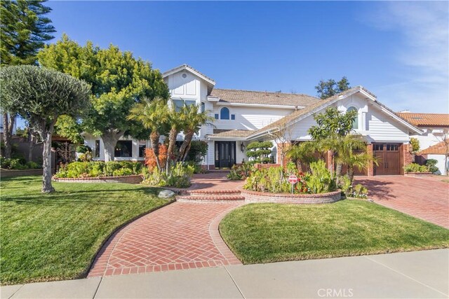 29515 Weeping Willow Dr, Agoura Hills, CA 91301 - view of front of property featuring a front lawn, an attached garage, decorative driveway, and a tile roof
