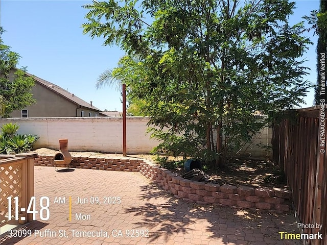 33099 Puffin St, Temecula, CA 92592 - fenced backyard featuring a patio area