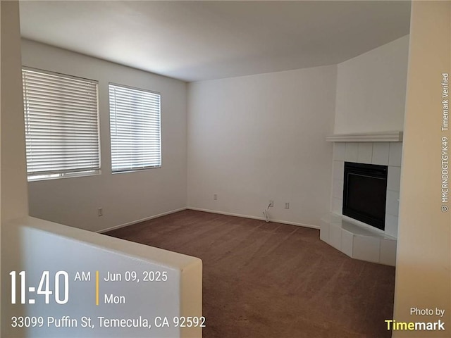 33099 Puffin St, Temecula, CA 92592 - unfurnished living room featuring a tile fireplace and carpet floors