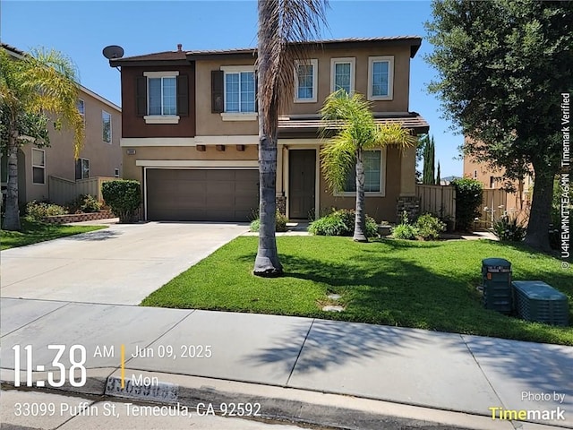 33099 Puffin St, Temecula, CA 92592 - view of front facade with stucco siding, an attached garage, and driveway