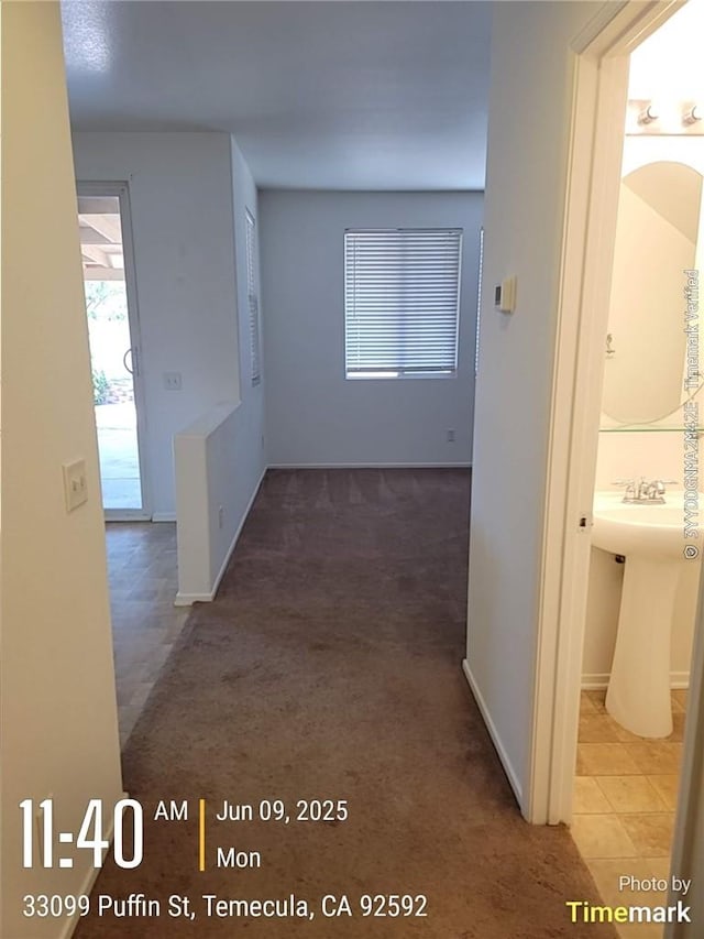 33099 Puffin St, Temecula, CA 92592 - corridor with plenty of natural light and carpet
