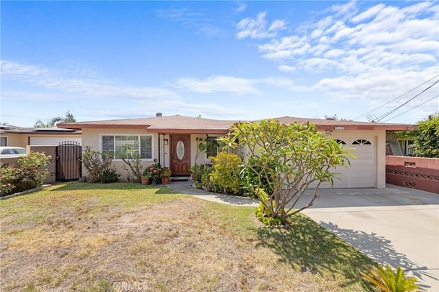 143581/2 Jeanette Ln, Baldwin Park, CA 91706 - single story home featuring driveway, stucco siding, a garage, and a gate
