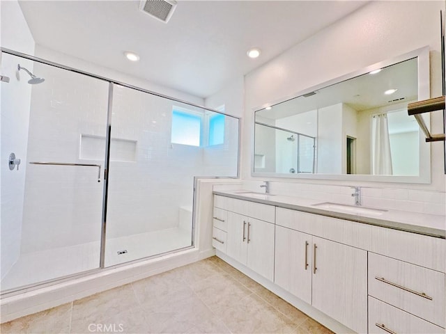 229 Radial, Irvine, CA 92618 - full bathroom with double vanity, a shower stall, tile patterned flooring, and recessed lighting