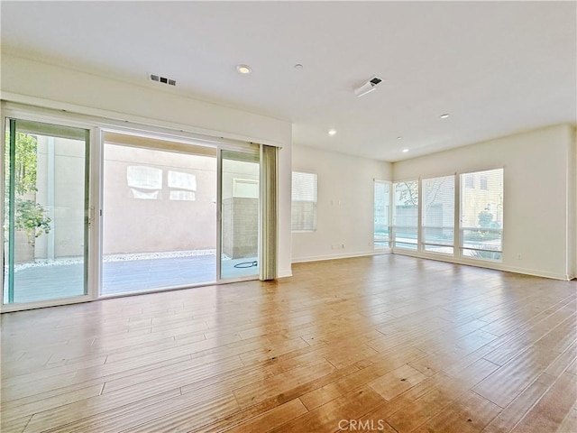 229 Radial, Irvine, CA 92618 - unfurnished room featuring light wood-style flooring, baseboards, and recessed lighting