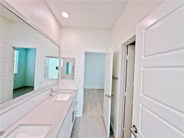 229 Radial, Irvine, CA 92618 - full bathroom with double vanity, recessed lighting, and tile patterned floors