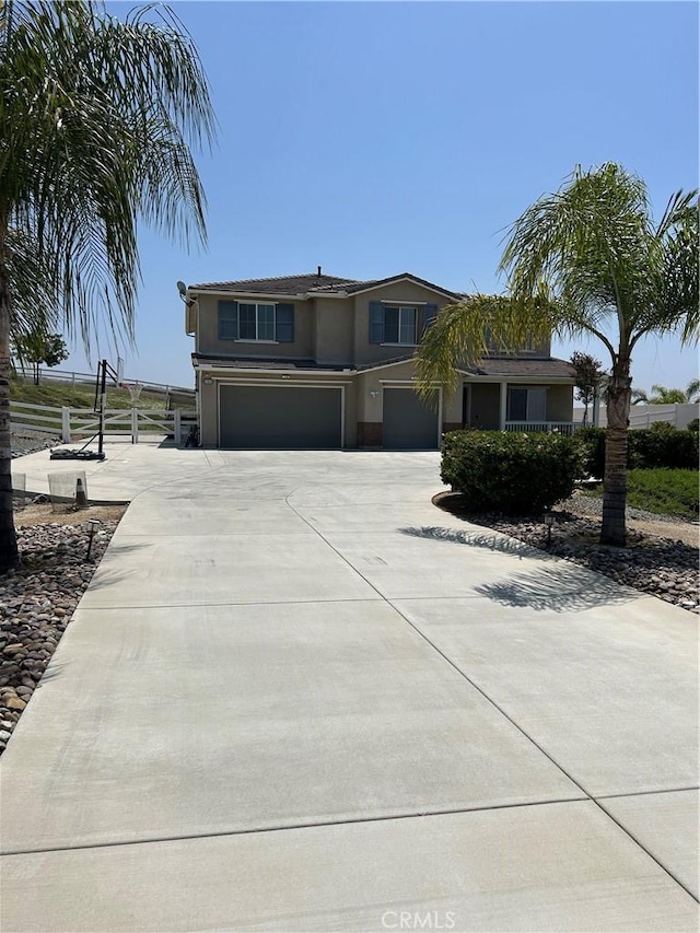 17426 Fairbreeze Ct, Riverside, CA 92504 - view of front of house with a garage and concrete driveway