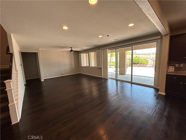 17426 Fairbreeze Ct, Riverside, CA 92504 - unfurnished living room featuring ceiling fan, dark wood-style flooring, stairway, and recessed lighting