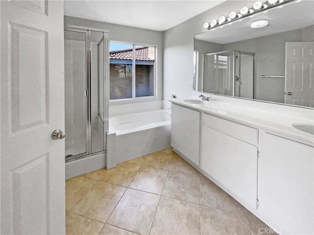 7411 Bull Run Pl, Fontana, CA 92336 - bathroom featuring a stall shower, double vanity, a bath, and tile patterned floors