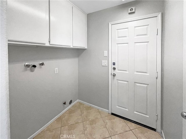 7411 Bull Run Pl, Fontana, CA 92336 - washroom with gas dryer hookup, cabinet space, light tile patterned flooring, baseboards, and washer hookup