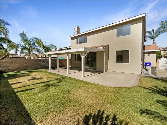7411 Bull Run Pl, Fontana, CA 92336 - back of house featuring stucco siding, a chimney, a patio, central AC unit, and a tile roof