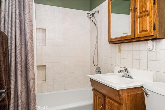 365 N Lime St, Orange, CA 92868 - full bathroom with shower / tub combo with curtain, tile walls, vanity, toilet, and backsplash