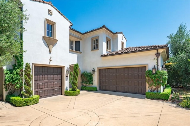 2108 S 2nd Ave, Arcadia, CA 91006 - mediterranean / spanish home featuring a tiled roof, stucco siding, and driveway