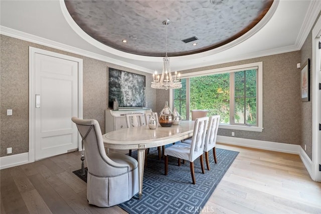 2108 S 2nd Ave, Arcadia, CA 91006 - dining area featuring a tray ceiling, wood finished floors, a chandelier, crown molding, and wallpapered walls