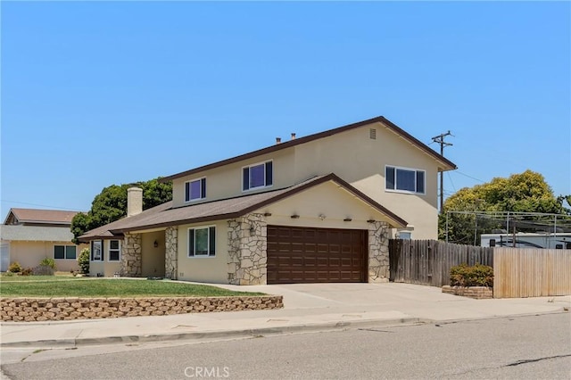 4198 Woodland St, Santa Maria, CA 93455 - traditional-style home with stone siding, driveway, a chimney, and stucco siding