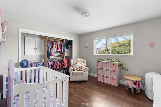 4198 Woodland St, Santa Maria, CA 93455 - bedroom with wood finished floors, a crib, baseboards, and a closet