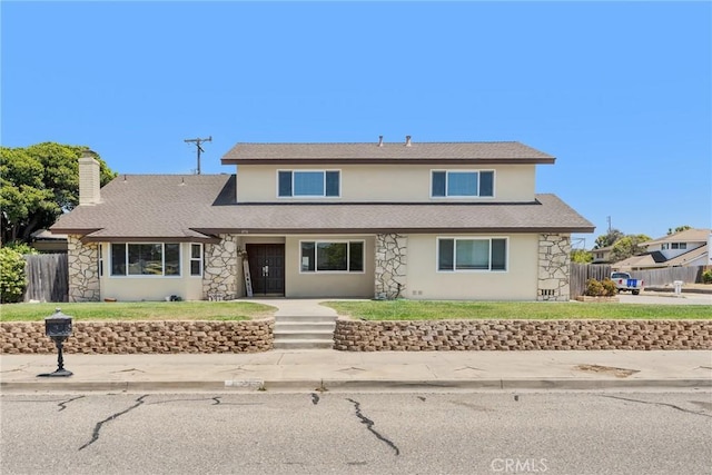 4198 Woodland St, Santa Maria, CA 93455 - traditional-style house featuring stone siding, stucco siding, a chimney, and a shingled roof