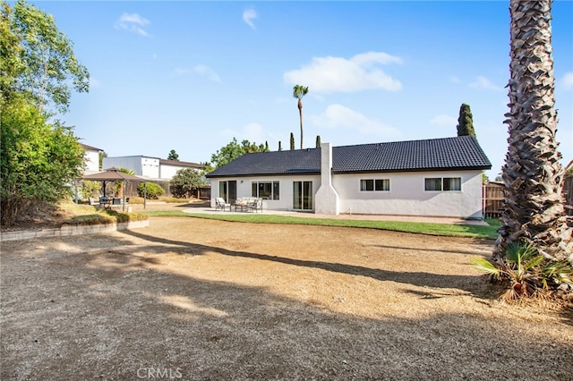 18165 Sharon Cir, Yorba Linda, CA 92886 - back of property with a gazebo, a patio area, a tiled roof, and stucco siding