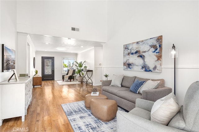 18165 Sharon Cir, Yorba Linda, CA 92886 - living area featuring light wood-style floors, a high ceiling, and crown molding