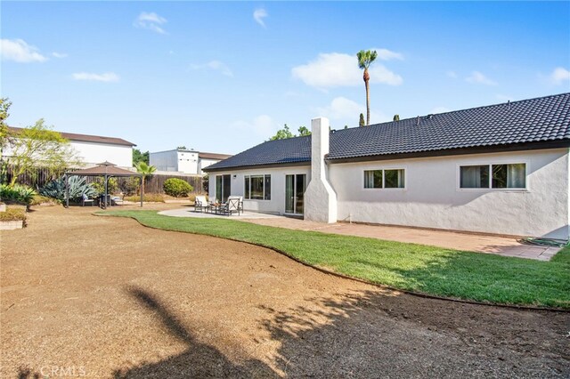18165 Sharon Cir, Yorba Linda, CA 92886 - back of house featuring a gazebo, stucco siding, a tiled roof, and a patio