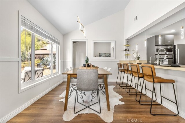 18165 Sharon Cir, Yorba Linda, CA 92886 - dining room with vaulted ceiling and wood finished floors