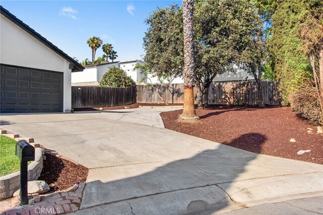 18165 Sharon Cir, Yorba Linda, CA 92886 - view of yard with concrete driveway and a garage