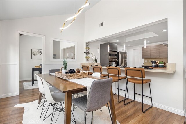 18165 Sharon Cir, Yorba Linda, CA 92886 - dining room with light wood finished floors and high vaulted ceiling