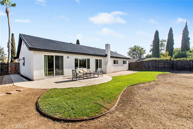 18165 Sharon Cir, Yorba Linda, CA 92886 - rear view of house featuring a fenced backyard, a patio, stucco siding, and a tile roof