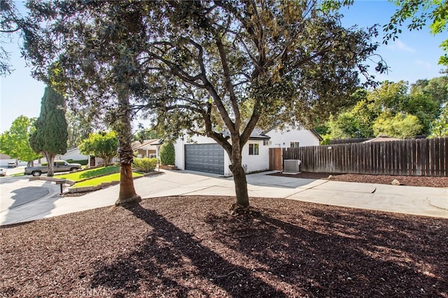 18165 Sharon Cir, Yorba Linda, CA 92886 - view of side of property with concrete driveway and a garage