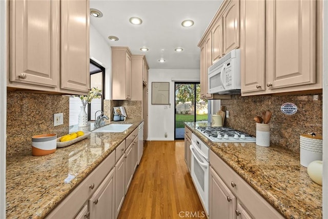 314 S Old Ranch Rd, Arcadia, CA 91007 - kitchen with a sink, white appliances, light wood-type flooring, baseboards, and light stone countertops