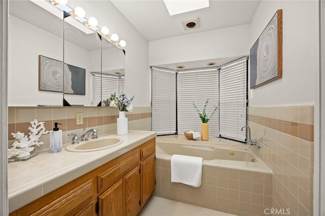 314 S Old Ranch Rd, Arcadia, CA 91007 - bathroom with vanity, a garden tub, a skylight, and tile patterned flooring