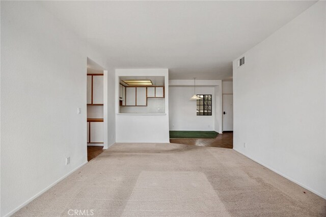 221 S Oak Knoll Ave Unit 308, Pasadena, CA 91101 - unfurnished living room featuring carpet flooring and baseboards