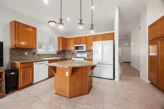 39798 Fairview Ct, Murrieta, CA 92563 - kitchen featuring white appliances, tasteful backsplash, a sink, brown cabinetry, and light tile patterned flooring