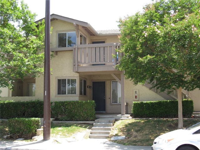 113 Rockwood, Irvine, CA 92614 - view of front of property featuring a balcony and stucco siding