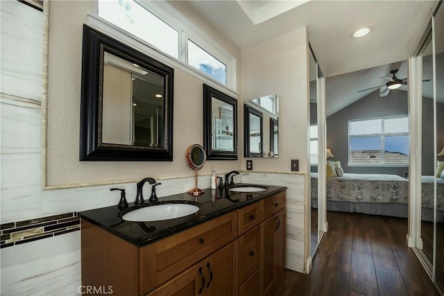 11103 Muirfield Dr, Rancho Cucamonga, CA 91730 - full bath with ensuite bathroom, healthy amount of natural light, double vanity, ceiling fan, and lofted ceiling