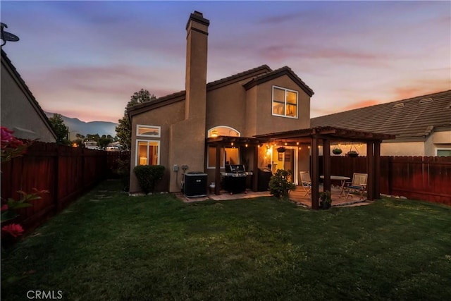 11103 Muirfield Dr, Rancho Cucamonga, CA 91730 - back of house at dusk with a pergola, a patio, a chimney, central air condition unit, and stucco siding