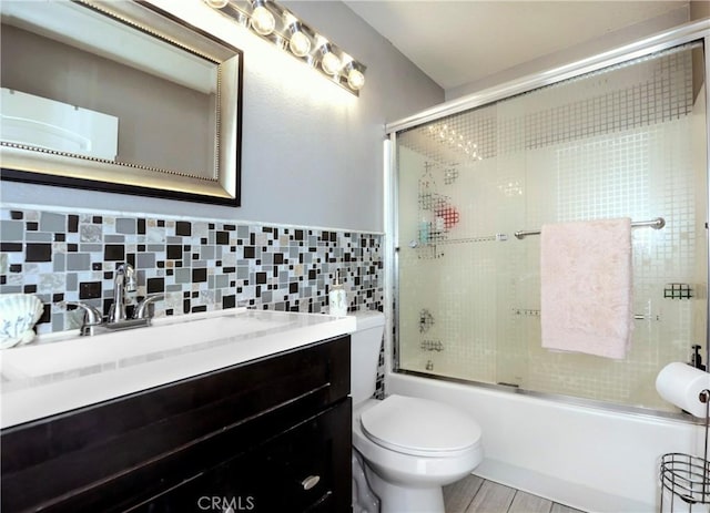 11103 Muirfield Dr, Rancho Cucamonga, CA 91730 - bathroom featuring vanity, toilet, enclosed tub / shower combo, and backsplash