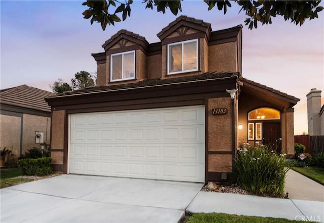 11103 Muirfield Dr, Rancho Cucamonga, CA 91730 - traditional-style house with driveway, a garage, a tiled roof, and stucco siding