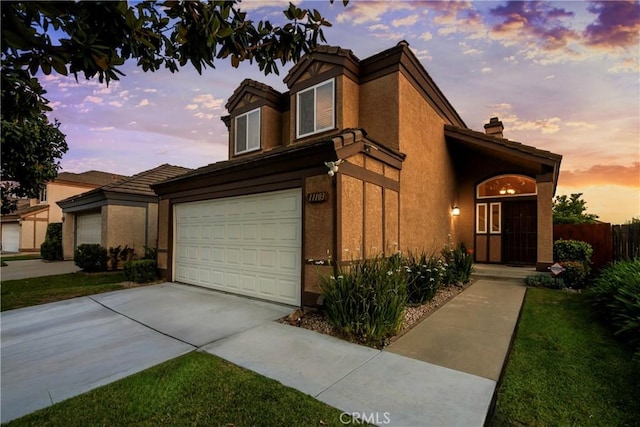 11103 Muirfield Dr, Rancho Cucamonga, CA 91730 - view of front of property featuring a garage, stucco siding, concrete driveway, and a tile roof