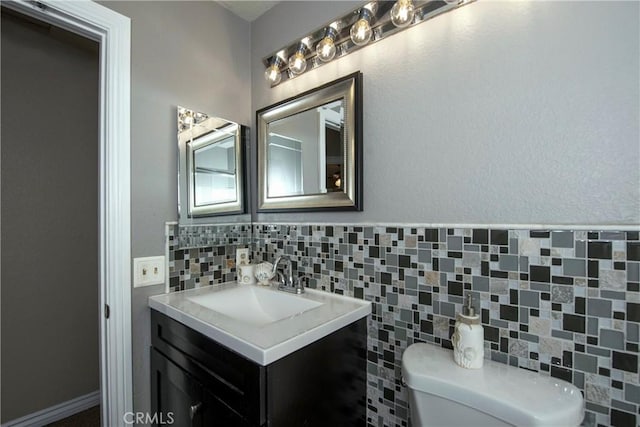 11103 Muirfield Dr, Rancho Cucamonga, CA 91730 - half bathroom featuring toilet, vanity, and decorative backsplash