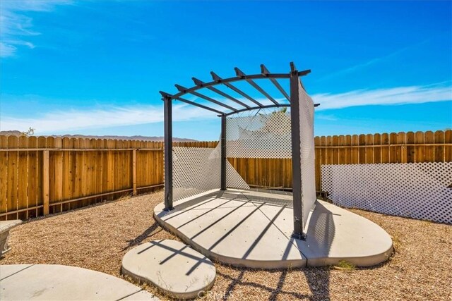 63357 Uranium Rd, Joshua Tree, CA 92252 - fenced backyard with a pergola and a patio