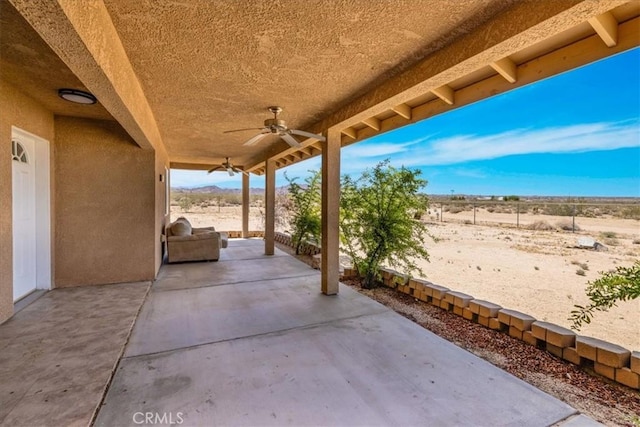 63357 Uranium Rd, Joshua Tree, CA 92252 - view of patio featuring a ceiling fan and a mountain view