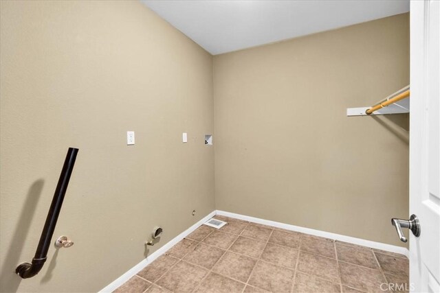 63357 Uranium Rd, Joshua Tree, CA 92252 - laundry area featuring washer hookup, baseboards, and light tile patterned floors