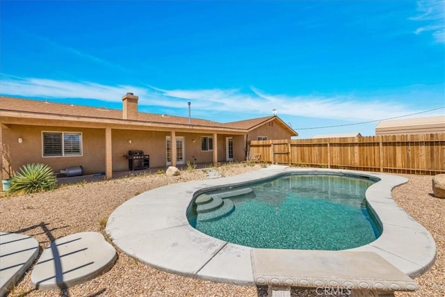63357 Uranium Rd, Joshua Tree, CA 92252 - view of swimming pool featuring area for grilling, a fenced backyard, and a patio