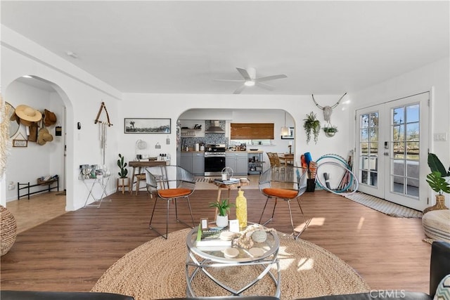 55436 Cone Blvd, Landers, CA 92285 - living room with arched walkways, wood finished floors, and ceiling fan