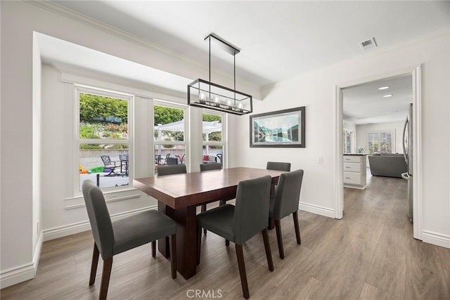 20660 Calle Feliz, Yorba Linda, CA 92886 - dining area featuring wood finished floors, a chandelier, baseboards, and ornamental molding
