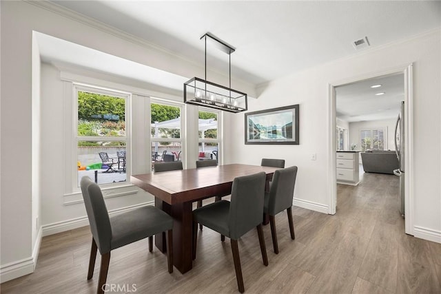 20660 Calle Feliz, Yorba Linda, CA 92886 - dining area with wood finished floors, a chandelier, and ornamental molding