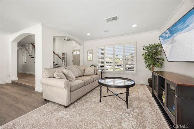 20660 Calle Feliz, Yorba Linda, CA 92886 - living room featuring arched walkways, ornamental molding, wood finished floors, stairs, and recessed lighting