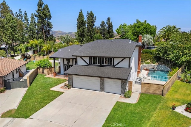 20660 Calle Feliz, Yorba Linda, CA 92886 - tudor house with driveway, an attached garage, roof with shingles, a chimney, and stone siding